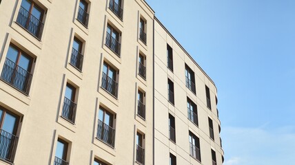 Fragment of modern luxury residential apartment,  home house building concept. Modern apartment building on a sunny day with a blue sky.