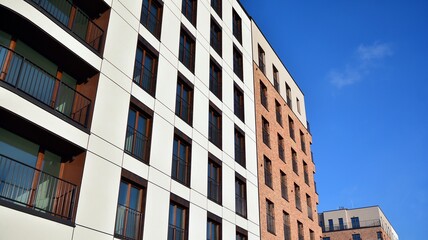 Fragment of modern luxury residential apartment,  home house building concept. Modern apartment building on a sunny day with a blue sky.