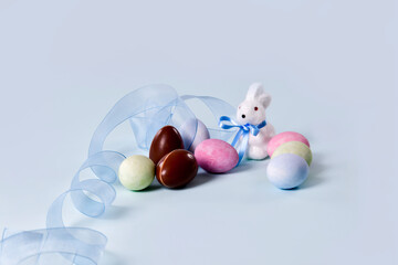Painted eggs, chocolate eggs and cute bunny figurine