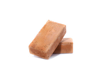 Red bricks isolated on white background. Solid clay bricks used for construction.