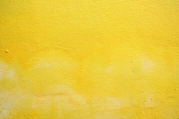Fototapeta premium Yellow Painting on Concrete Wall Background, Suitable for Construction and Architecture Concept.