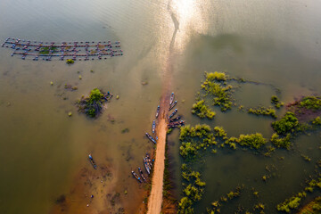 Aerial view Drone top view of Longtail fishing boats in the river.