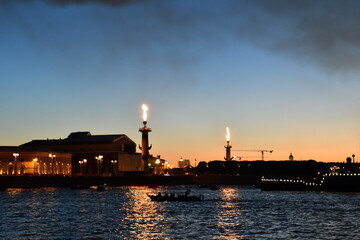 Fototapeta na wymiar Rostral column in St Petersburg during Navy day celebration, Neva river
