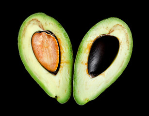 Avocado cut section macro shot isolated on black background