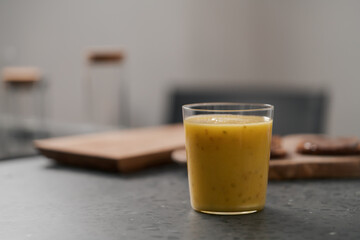 Fresh mango lulo smoothie on kitchen countertop