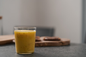 Fresh mango lulo smoothie on kitchen countertop
