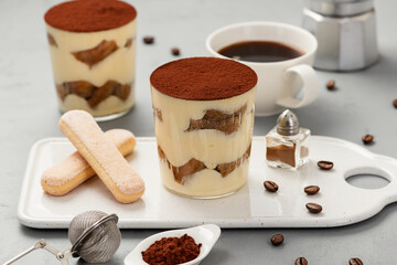 Traditional Italian dessert tiramisu in a glass.