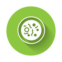 White Petri dish with bacteria icon isolated with long shadow. Green circle button. Vector.