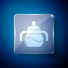 Obraz premium White Baby bottle icon isolated on blue background. Feeding bottle icon. Milk bottle sign. Square glass panels. Vector.