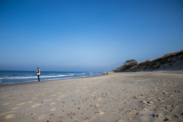 person walking on the beach