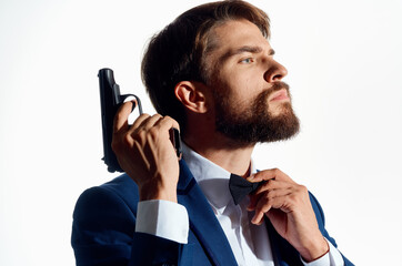 man in a suit holding a pistol lifestyle gangster Mafia close-up