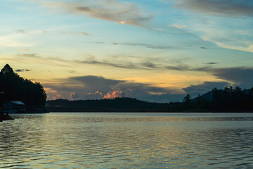 Golden hour sunrise in Kenyir Lake, Terengganu, Malaysia.