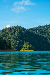 Fototapeta na wymiar Kenyir lake small islands with beautiful rainforest tropical jungle. Scenic landscape view. Located in Terengganu, Malaysia.