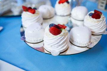 Sweet cupcakes and cakes for a children's party. Confectionery.
