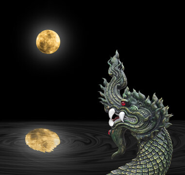 Naga Head the King of Sneak Serpent Statue  with fullmoon at night, Phayanak or naga statue in Thailand