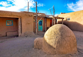 Old houses under the sunlight and a blue sky in Taos Pueblo, New Mexico