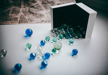 colored balls are poured out of the box