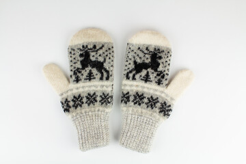 women's winter knitted mittens on a white background