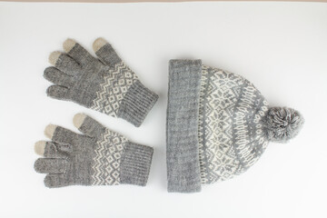 women's winter knitted mittens with a hat on a white background