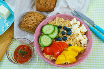 Bulgur porridge with vegetables and sauce top view