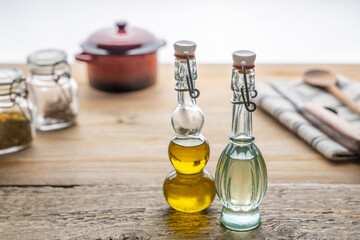 Obraz na płótnie Canvas Variation of vegan cooking oils. Variation of trendy vegan cooking oils in a small jar on a table top .