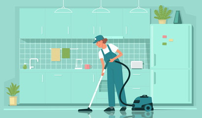 Cleaning service. Female cleaner employee in uniform vacuums the floor in the kitchen. House or apartment cleaning
