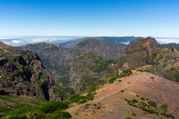 Naklejka premium Beautiful panorama view of the landscape in the mountains at Pico do Areeiro with blue sky, Madeira Island