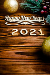 Happy new year 2021 on wooden brown background
