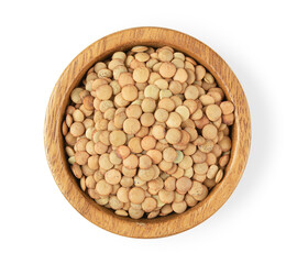 Uncooked lentils in wooden bowl isolated on white background. Top view