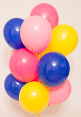 Fototapeta na wymiar a cloud of helium balloons on a white background. 