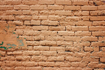 A fragment of a decrepit textured wall painted with paint