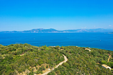 Fototapeta na wymiar Panoramic aerial view of the Corsican coast with a mountain village near the capital Ajaccio. Corsica, France. Tourism and vacations concept.