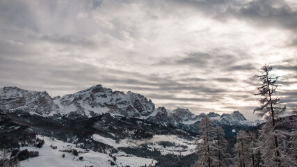 Stormy clouds in italian dolomites in a snowy winter