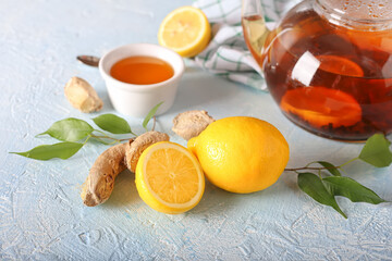 Tea, lemon, honey and ginger healthy on the light background