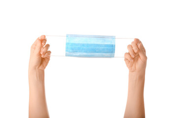 Medical mask in hands on a white background