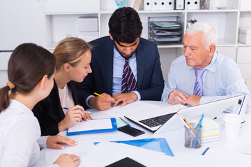Office workers are writing financial reports in the office.