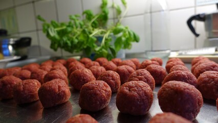 Homemade meatballs on the kitchen counter ready to be cooked