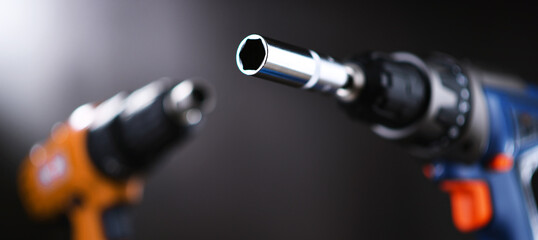 A screw gun and a pistol-grip cordless drill