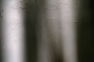 Obraz premium Light Beam and Shadow on Grunge Concrete Wall.