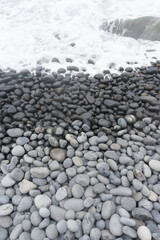 Stone beach, waves come in