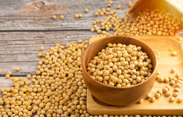 Soybeans in brown wooden bowl on wooden table background.Healthy food Concept.