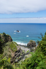 Fototapeta na wymiar Walk along turquoise ocean and rocky cliffs on Madeira Island