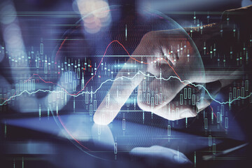 Multi exposure of man's hands holding and using a phone and financial chart drawing. Market analysis concept.