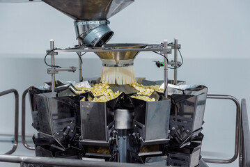 Vertical multi-head weigher packaging machine snacks and chips in a factory