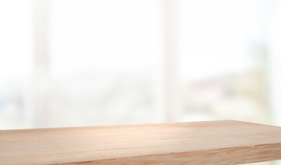 empty wooden table on background of abstract blur white interior, montage, product display, inside and window..