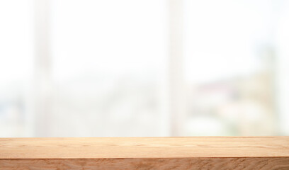 empty wooden table on background of abstract blur white interior, montage, product display, inside and window..