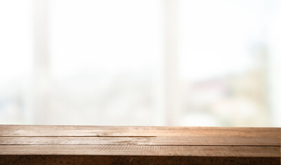 empty wooden table on background of abstract blur white interior, montage, product display, inside and window..