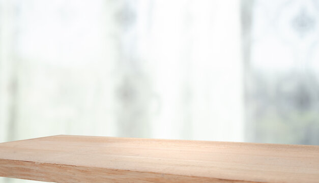 empty wooden table on background of abstract blur white interior, montage, product display, inside and window..