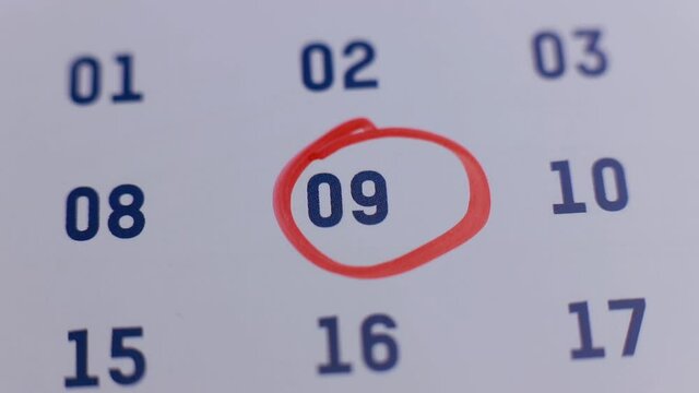 red marker pen circling the date 9 on the calendar