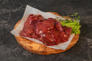 Raw chicken liver over board
